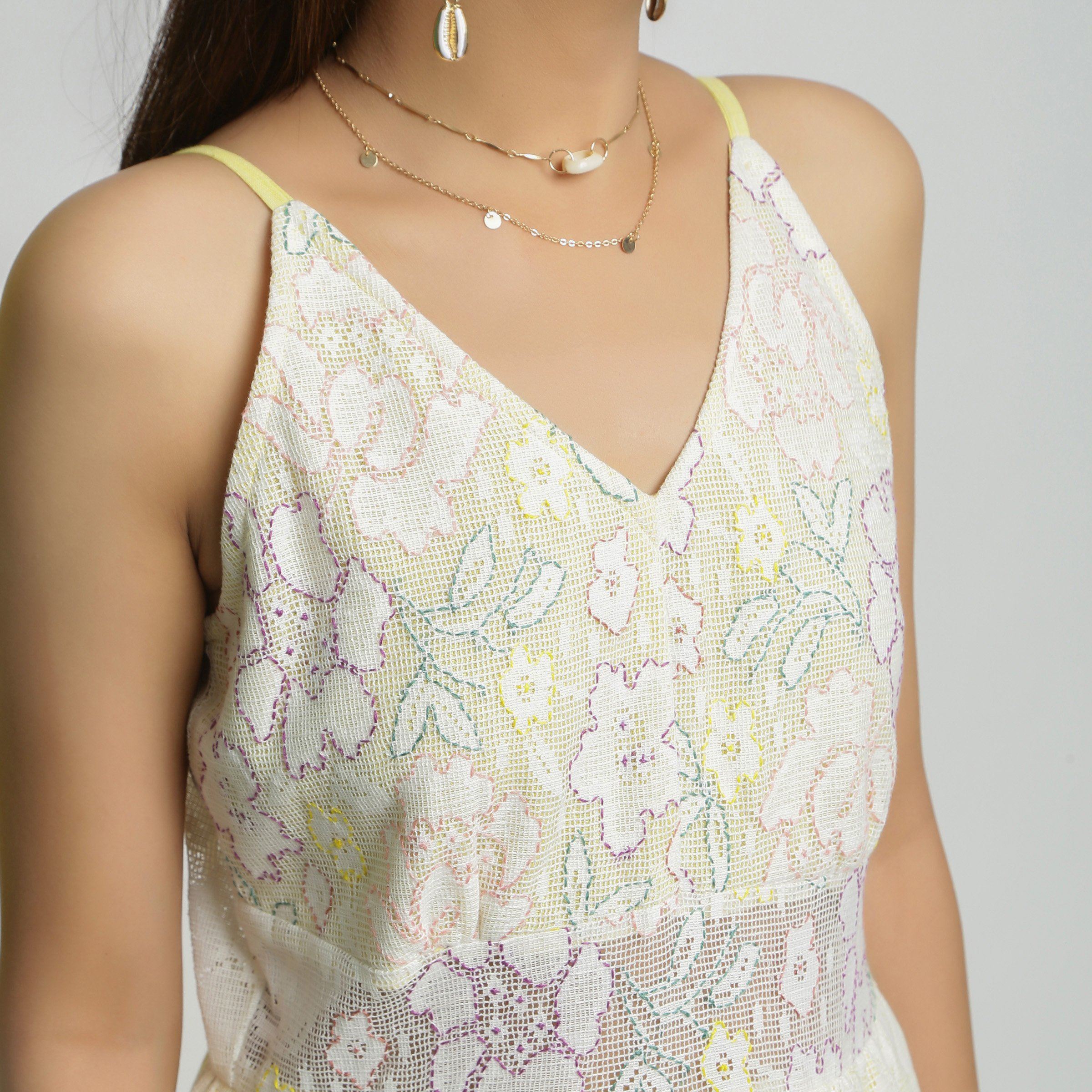 Front Detail of a Model wearing White Cotton Floral Straight Jumpsuit
