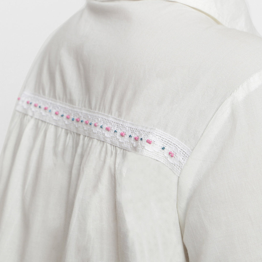 Back Detail of a Model wearing White Organic Cotton Lined Peter Pan Gathered Top