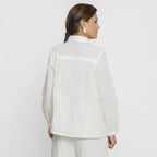 Back View of a Model wearing White Organic Cotton Lined Peter Pan Gathered Top