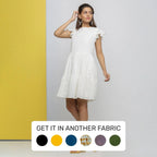 Front View of a Model wearing White Cotton Schiffli Short Tiered Dress