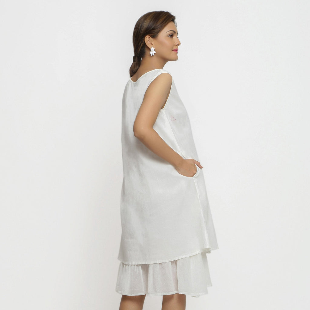 Back View of a Model wearing White Organic Cotton A-Line Knee Length Dress