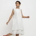Right View of a Model wearing White Organic Cotton A-Line Knee Length Dress