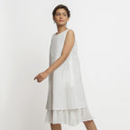 Left View of a Model wearing White Organic Cotton A-Line Knee Length Dress
