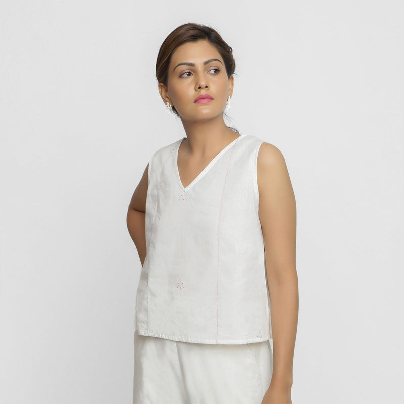 Front View of a Model wearing White Embroidered Organic Cotton Top