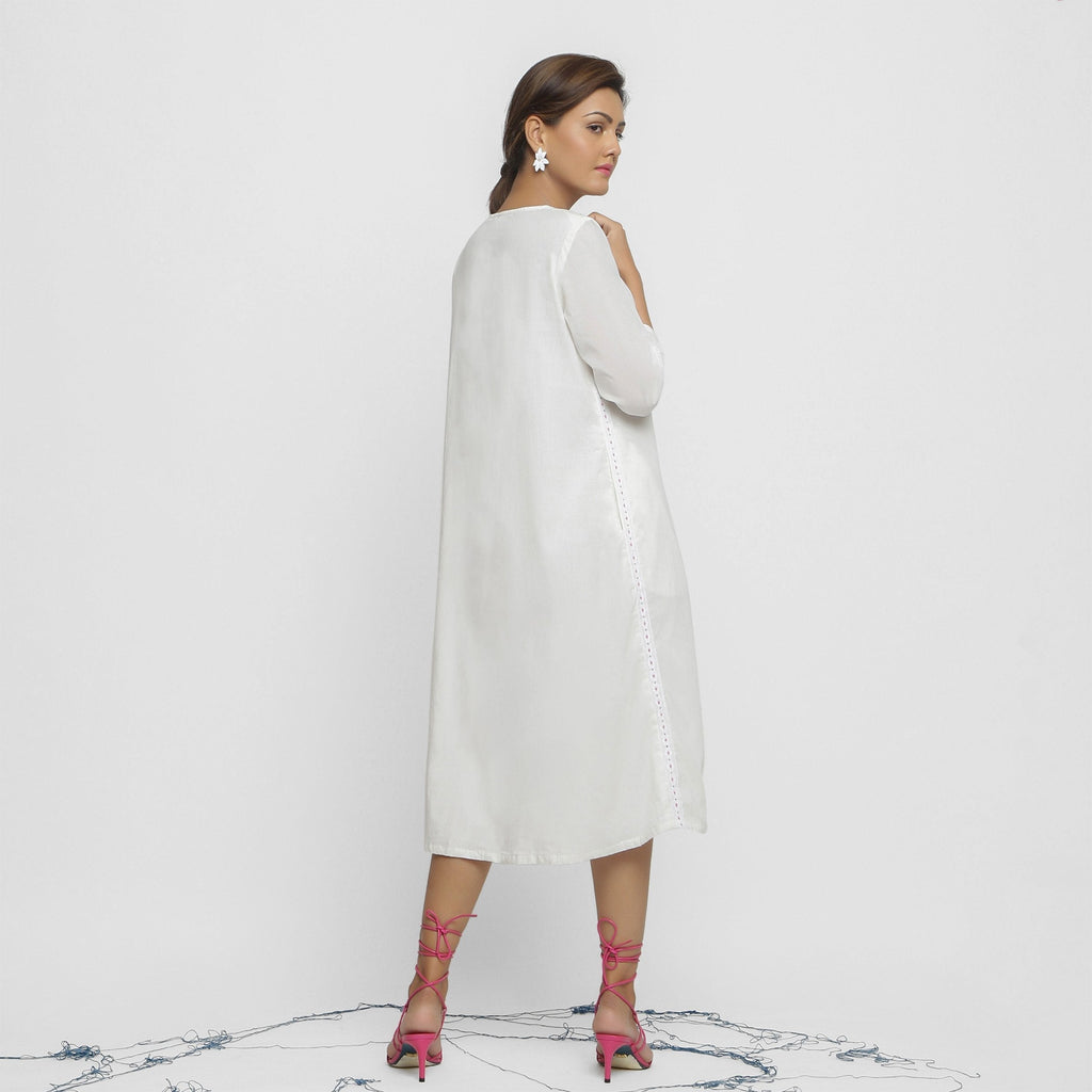 Back View of a Model wearing White Organic Cotton Hand Beaded Button-Down Midi Dress