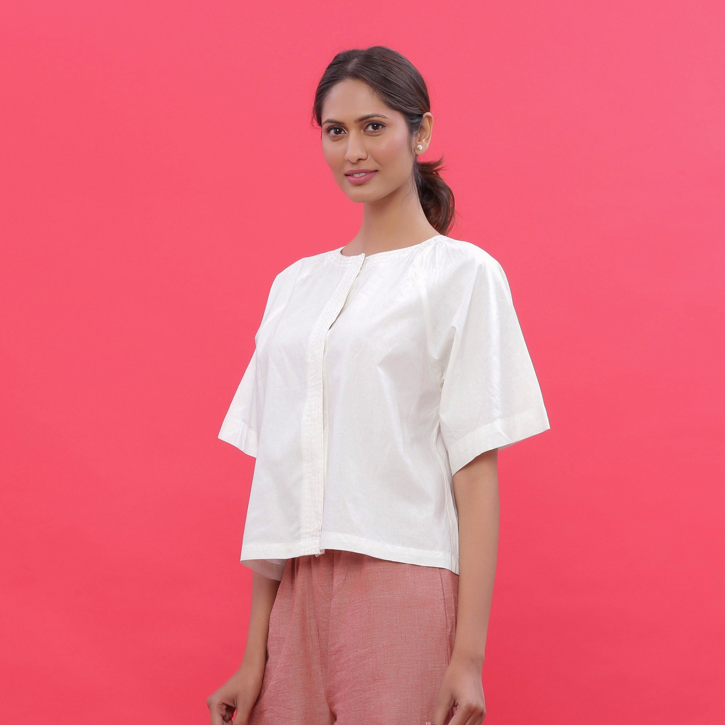 Left View of a Model wearing White Hand Embroidered Straight Top