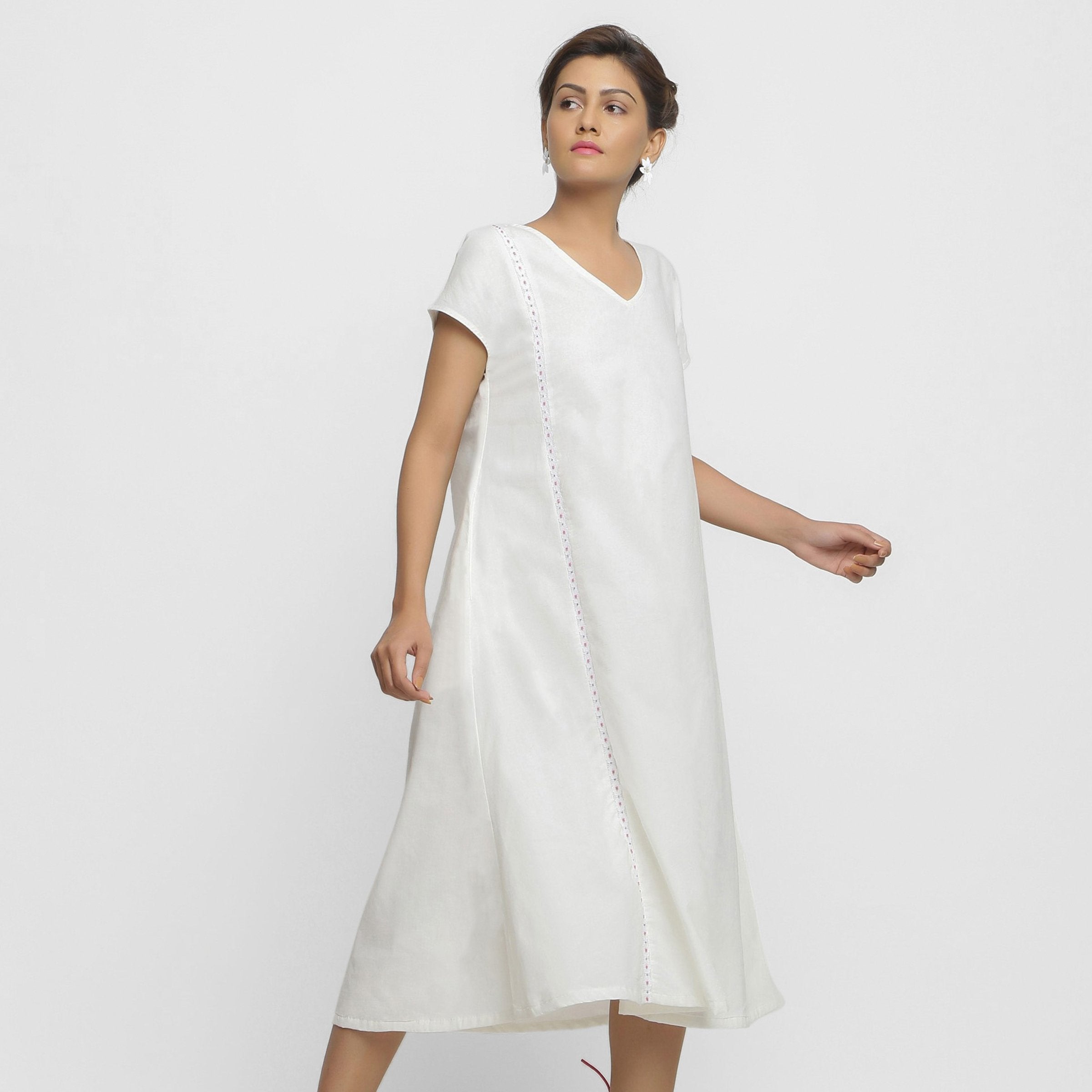 Right View of a Model wearing White Organic Cotton Lace Midi Flared Dress