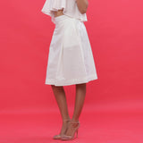 Left View of a Model wearing White Poplin A-Line Hand Beaded Skirt