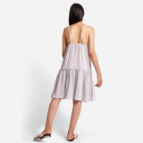 Back View of a Model wearing White Striped Cotton Knee Length Camisole Dress