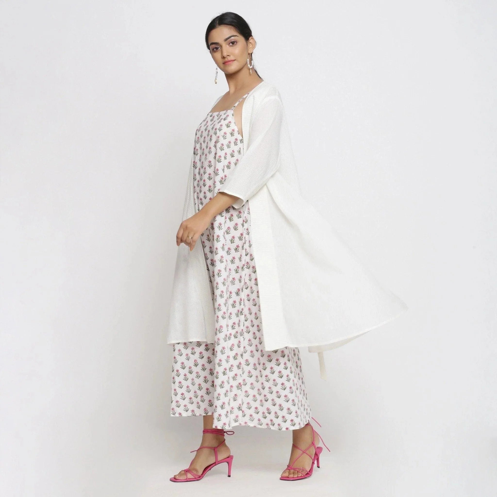 Left View of a Model wearing White Striped Knee Length Cotton Overlay