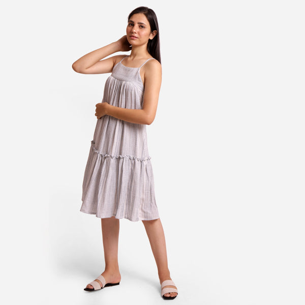 Left View of a Model wearing White Striped Cotton Knee Length Camisole Dress