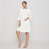 Front View of a Model wearing White Yoked Cotton Tunic Dress