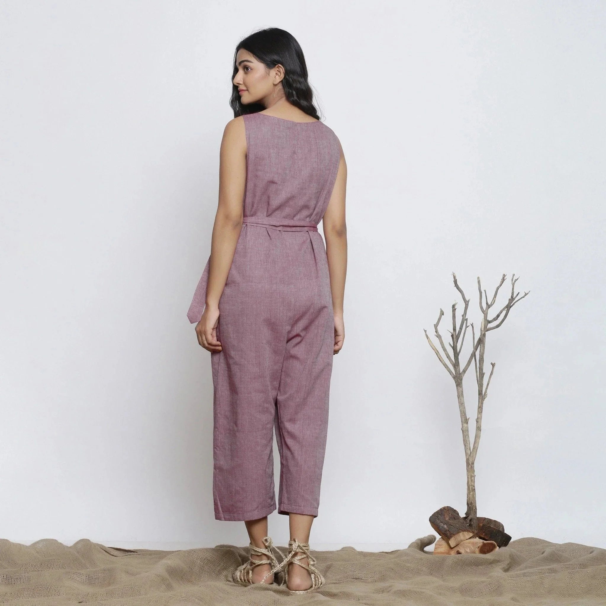 Back View of a Model wearing Wine Handspun Deep Neck Wrap Jumpsuit