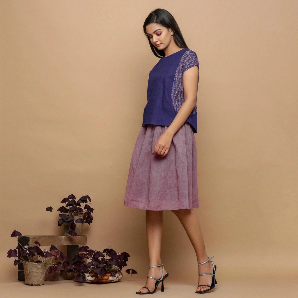 Left View of a Model wearing Wine Handspun Cotton Muslin Mid-Rise Paperbag Skirt
