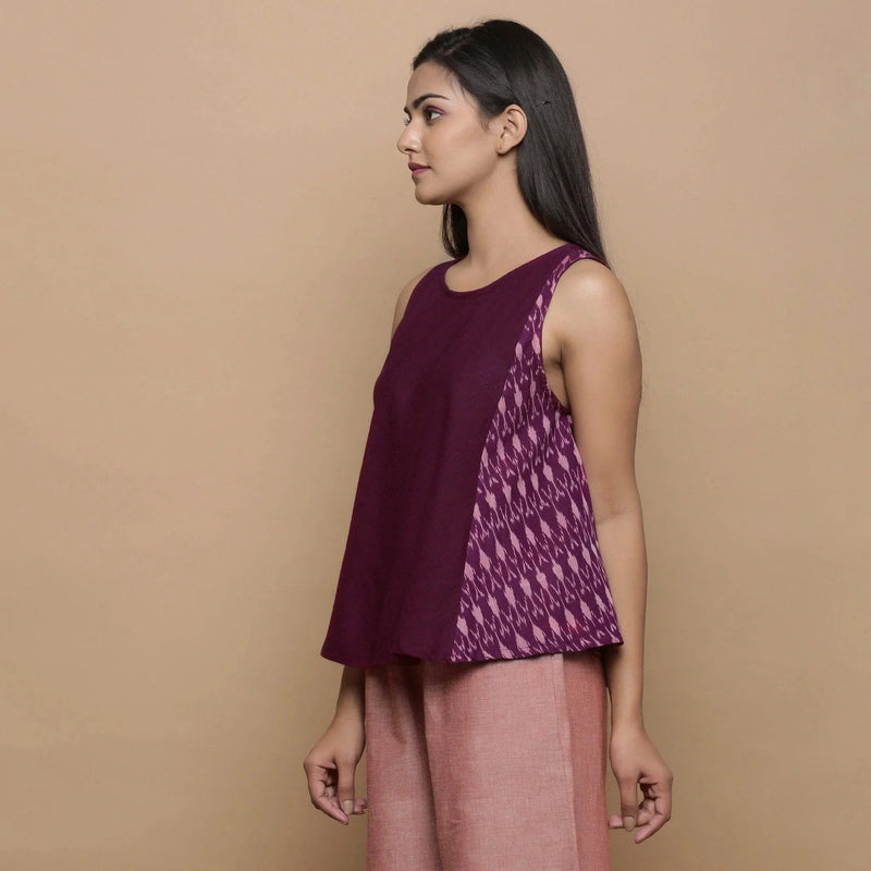 Left View of a Model wearing Wine Handwoven 100% Cotton Ikat Sleeveless Paneled Top