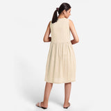 Back View of a Model wearing Yarn Dyed Cotton Beige Yoke Dress