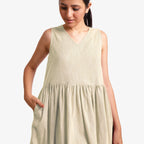 Front Detail of a Model wearing Yarn Dyed Cotton Beige Yoke Dress