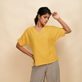 Front View of a Model wearing Yellow Handspun 100% Cotton Drop Shoulder Straight Top