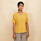Front View of a Model wearing Yellow Handspun 100% Cotton Drop Shoulder Straight Top
