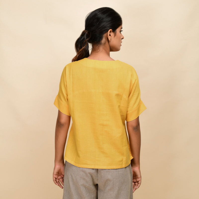 Back View of a Model wearing Yellow Handspun 100% Cotton Drop Shoulder Straight Top