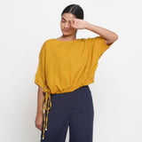 Front View of a Model wearing Solid Yellow Cotton Flax Blouson Top
