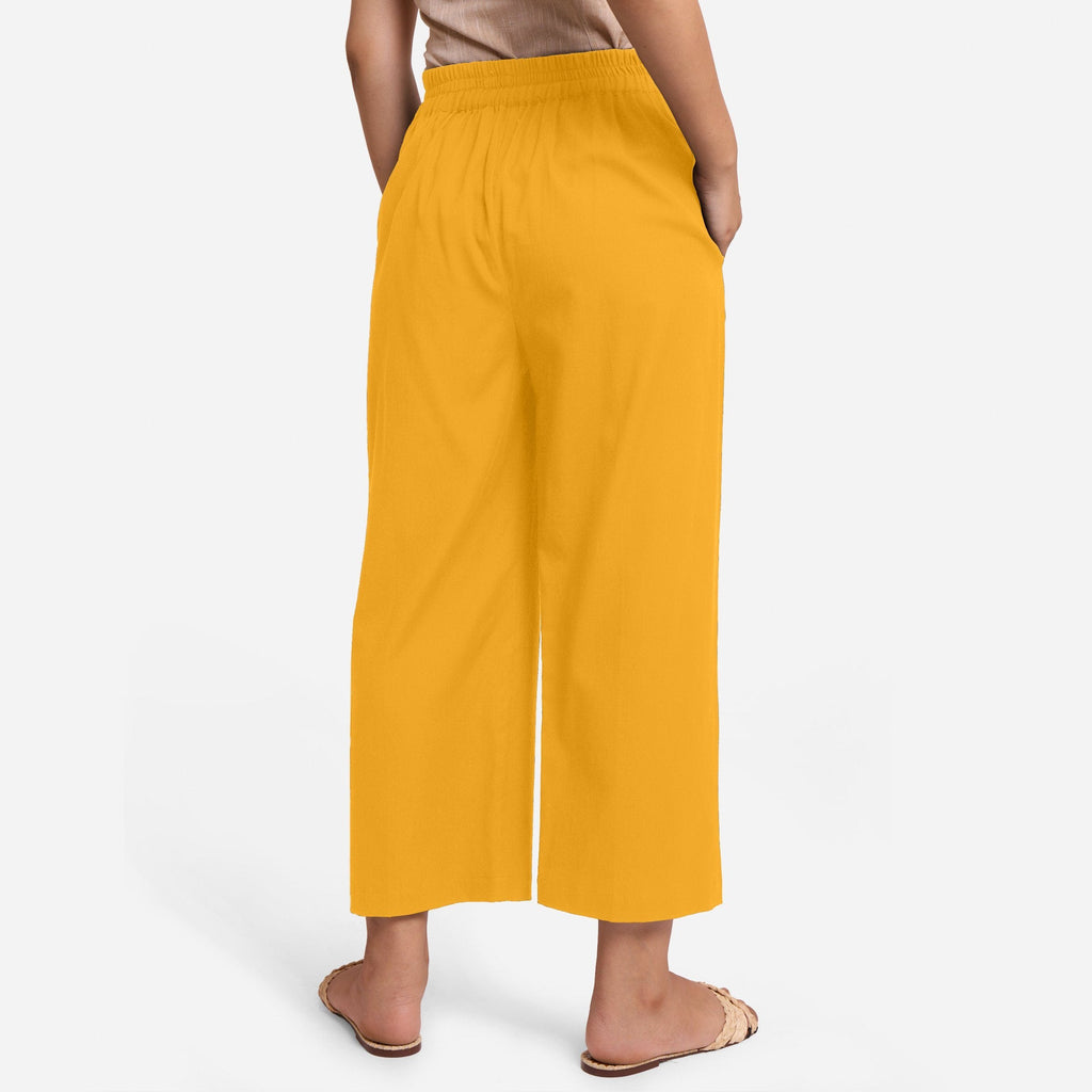 Back View of a Model wearing Yellow Cotton Flax Wide Legged Pant