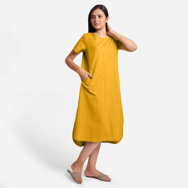 Right View of a Model wearing Yellow Cotton Welt Pocket Shift Dress