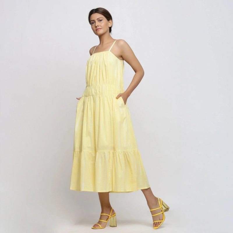 Left View of a Model wearing Yellow Hand Tie-Dye Cotton Midi Tiered Dress