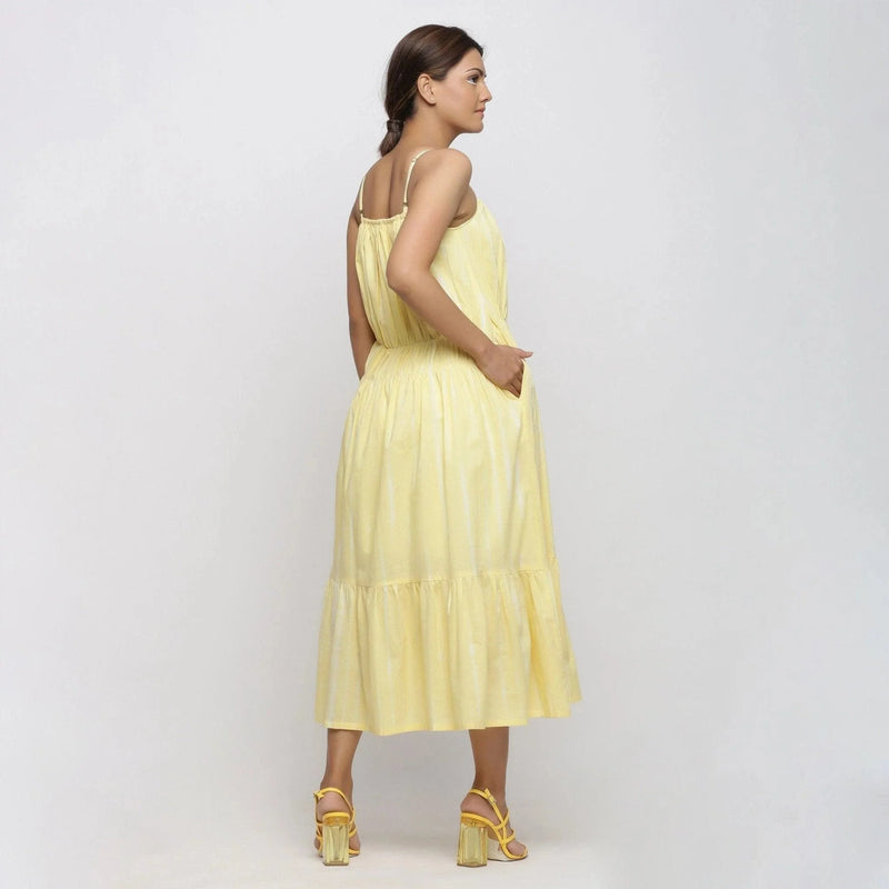 Back View of a Model wearing Yellow Hand Tie-Dye Cotton Midi Tiered Dress