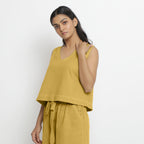 Left View of a Model wearing Yellow Handspun Cotton Vegetable Dyed Crop Top