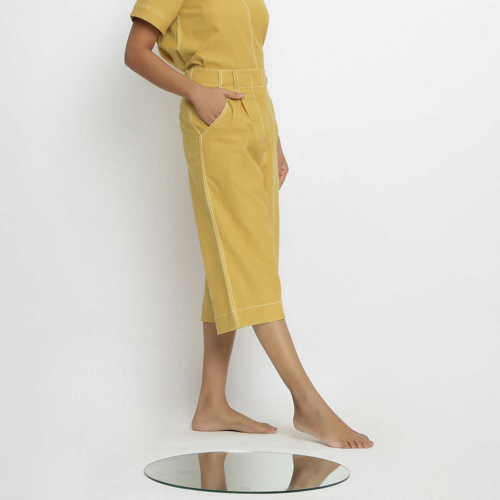 Right View of a Model wearing Yellow Vegetable Dyed Handspun Cotton Mid-Rise Culottes