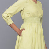 Right Detail of a Model wearing Yellow Pistachio V-Neck Corduroy Dress