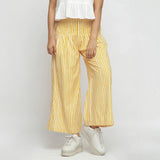 Front View of a Model wearing Yellow Striped Wide Legged Cotton Pant