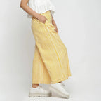 Right View of a Model wearing Yellow Striped Wide Legged Cotton Pant