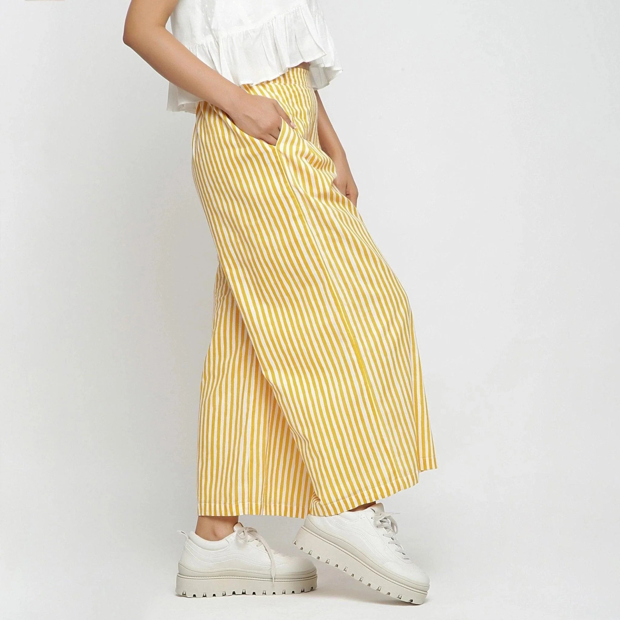 Right View of a Model wearing Yellow Striped Wide Legged Cotton Pant