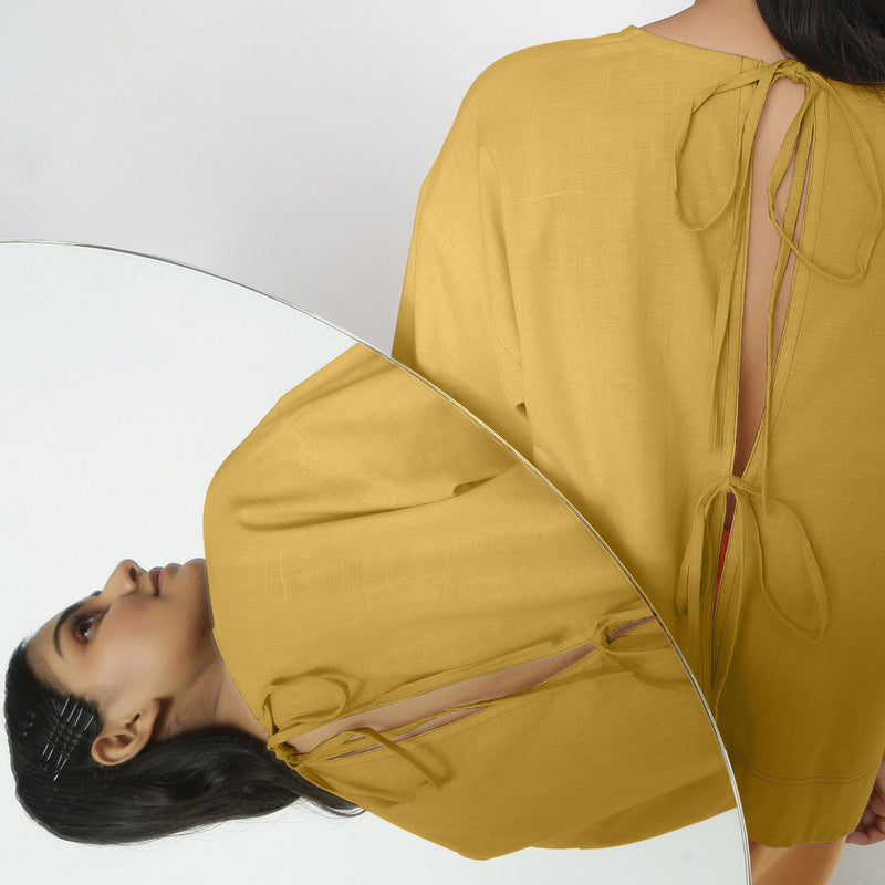 Back View of a Model wearing Yellow Vegetable-Dyed 100% Cotton Straight Top