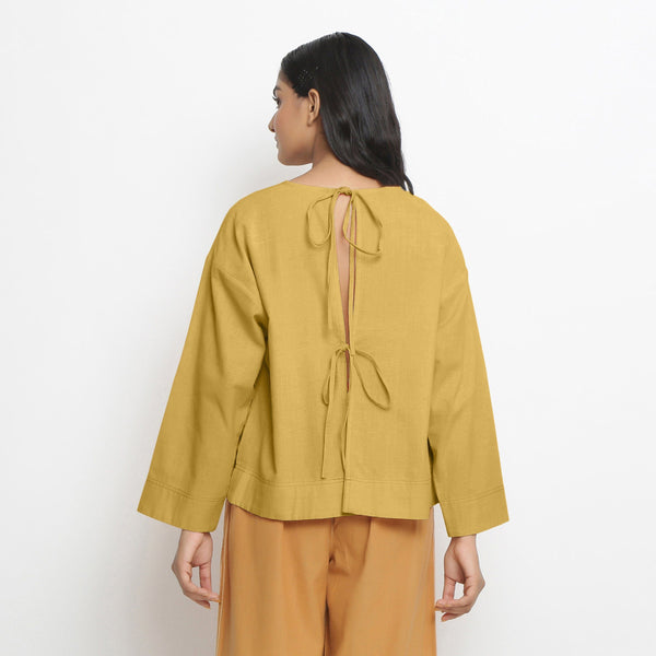 Back View of a Model wearing Yellow Vegetable-Dyed 100% Cotton Straight Top