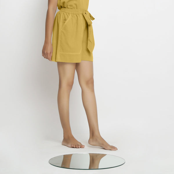 Right View of a Model wearing Yellow Vegetable Dyed Handspun Short Shorts