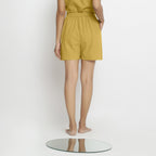 Back View of a Model wearing Yellow Vegetable Dyed Handspun Short Shorts