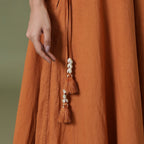 Close View of a Model wearing 6-Way Convertible Rust Sandstone Tie Dye Skirt Dress