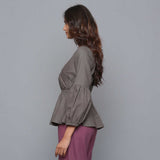 Left View of a Model wearing Ash Grey V-Neck Flannel Peplum Top