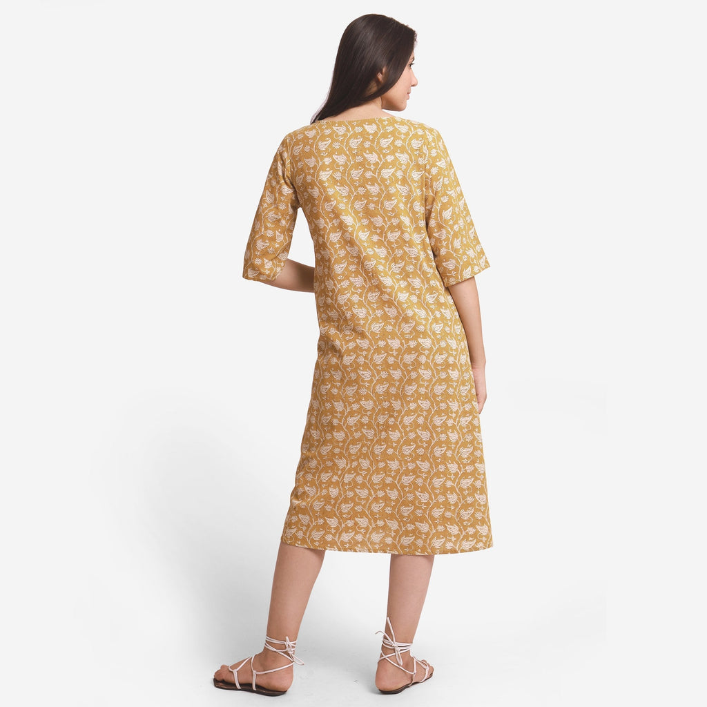 Back View of a Model wearing Bagru Block Print Mustard A-Line Cotton Dress