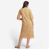 Back View of a Model wearing Bagru Block Print Mustard A-Line Cotton Dress