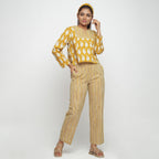 Front View of a Model wearing Bagru Block Print Mustard High Low Top