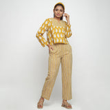 Front View of a Model wearing Bagru Block Print Mustard High Low Top