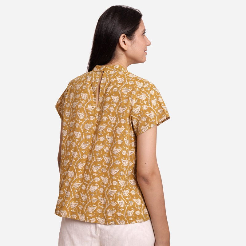Back View of a Model wearing Mustard Bagru Print Relaxed Fit Top