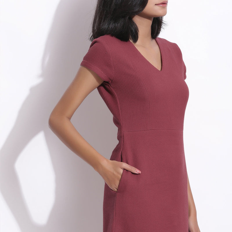 Right Detail of a Model wearing Barn Red Cotton Waffle V-Neck Dress