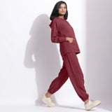 Right View of a Model wearing Barn Red Hoodie Sweatshirt and Pants Set