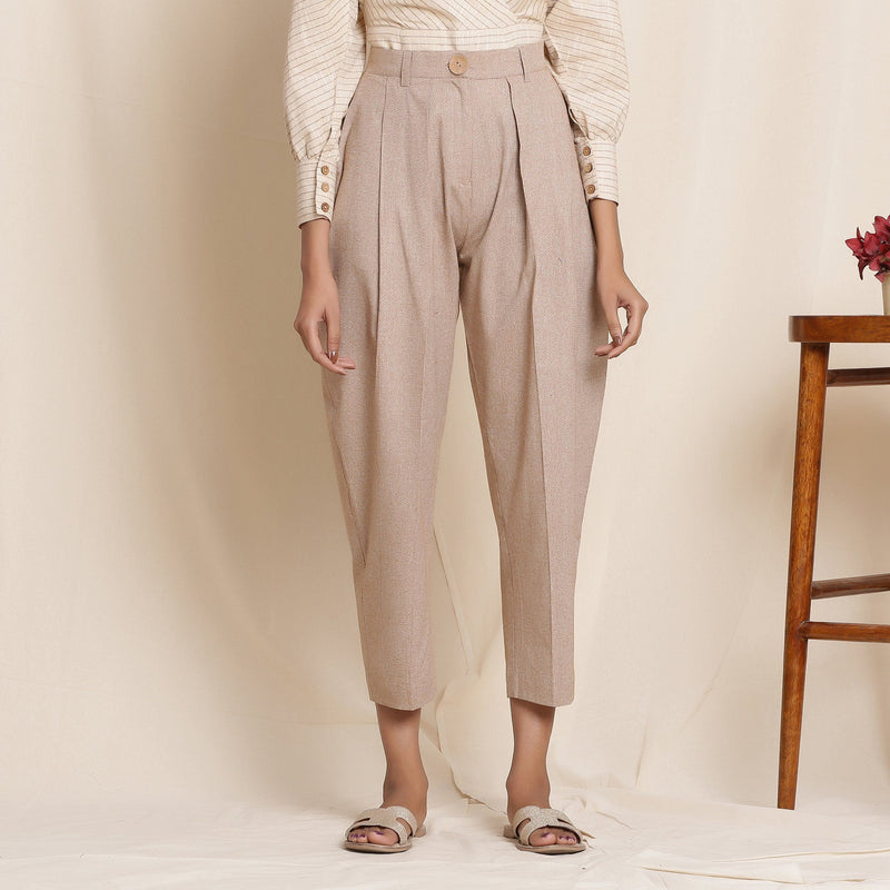 Front View of a Model Wearing Dusk Brown Box Pleated Pegged Pant