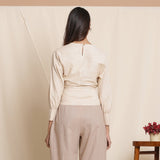 Back View of a Model Wearing Dusk Brown Box Pleated Pegged Pant